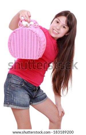 Smiley caucasian sweet little cute girl holding a picnic basket on white background/Cute little girl holding a basket
