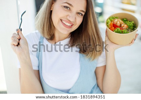The woman is on the right diet. Fat woman eats salad. High quality photo.