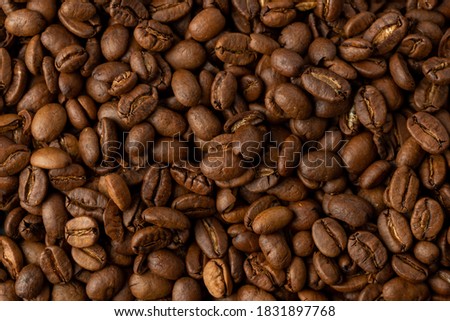 Close-up studio shot of freshly roasted espresso coffee beans. Macro photography, top view.  Royalty-Free Stock Photo #1831897768