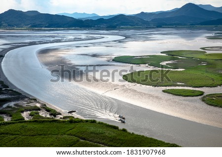 Aerial view of two fishing boats on the sea with mud flat at Suncheonman Bay of Waon Beach near Suncheon-si, South Korea
 Royalty-Free Stock Photo #1831907968