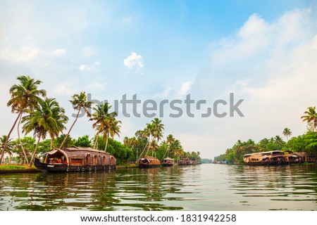A houseboat sailing in Alappuzha backwaters in Kerala state in India Royalty-Free Stock Photo #1831942258