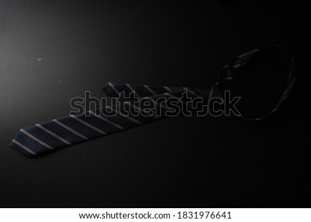 necktie with black background, no people , real photo.