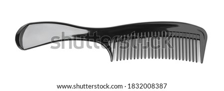Plastic black comb isolated on white.