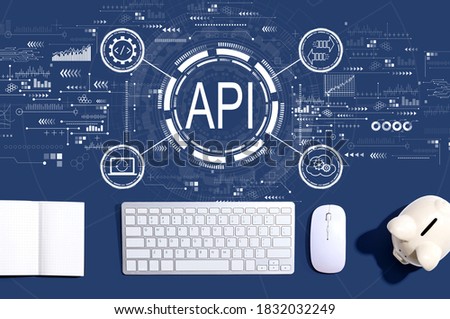 API - application programming interface concept with a computer keyboard and a piggy bank
