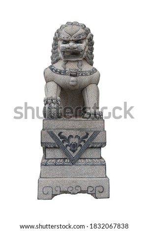 The Chinese lion (Beijing Lion) is carved from Granite stone isolated on a white background with clipping path.