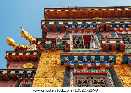 Facade of the Tibetan Buddhist monastery Ganden Sumtseling Songzanlin, Yunnan, China. Royalty-Free Stock Photo #1832072590