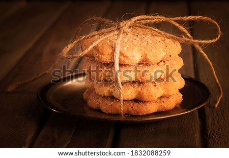 Nut cookies with rope on the wood table