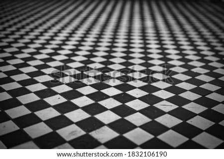 black and white square tiles leaving in perspective, blurry image