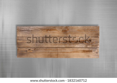 Brown wooden sign on a gray background