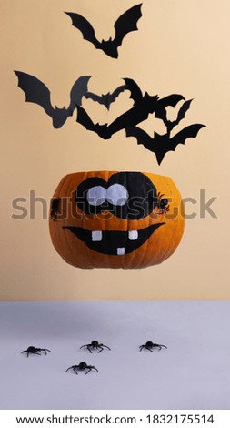 flying pumpkin with bats and spiders, Helloween pumpkin background, Halloween pumpkin with paper cut bats
