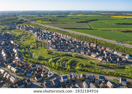Aerial view of uk home newly built estate development masterplan landscape in England, Royalty-Free Stock Photo #1832184916