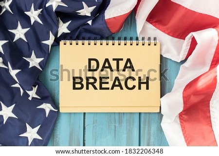 text Data Breach on notepad with american flag background
