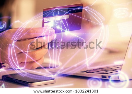 Multi exposure of woman on-line shopping holding a credit card and education theme drawing. E-learning concept.