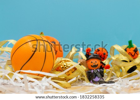 Basketball Halloween day with ball and pumpkin ghost