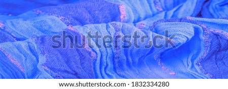 silk fabric, large stripes in blue separated by a red gold stripe, pattern background texture, ornament