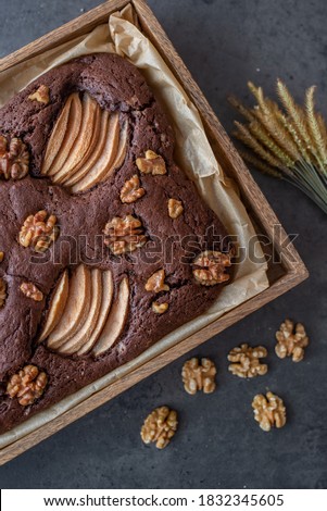 chocolate brownie with pear and walnuts