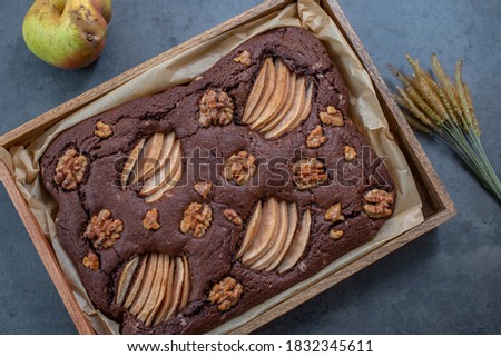 chocolate brownie with pear and walnuts