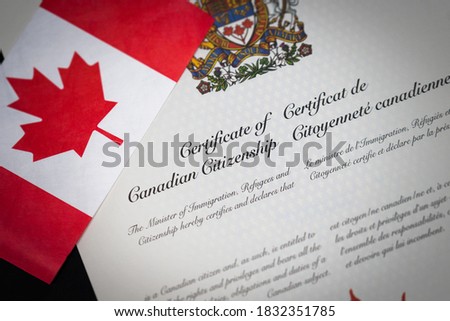 Canadian Citizenship Certificate with Canadian Flag Royalty-Free Stock Photo #1832351785