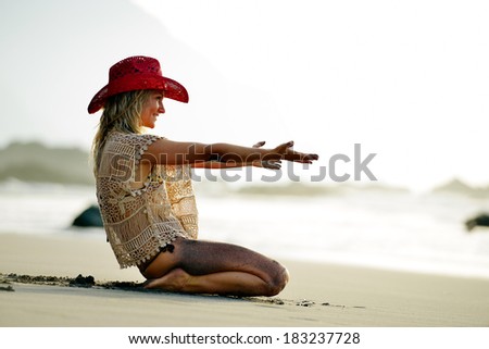 young woman relaxing on the beach in summer