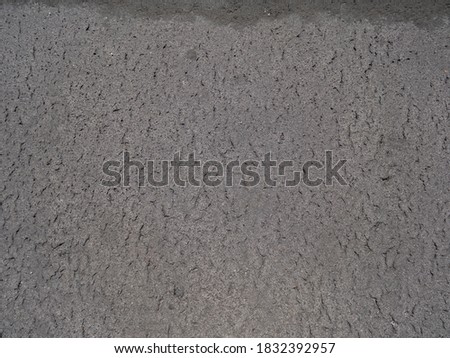 Surface grunge rough of asphalt, weathered tarmac dark grey grainy road. Texture background