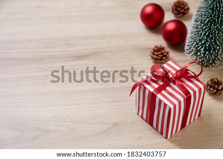 gift box ornament on wood background and space for text