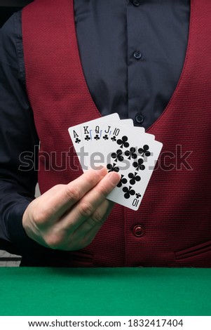 the dealer's hand is holding a black combination of winning cards