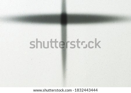 close up picture of a cross on paper