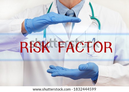 Doctor's hands with RISK FACTOR inscription. Medical concept