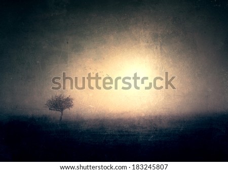 Grunge effected photo of lonely tree 