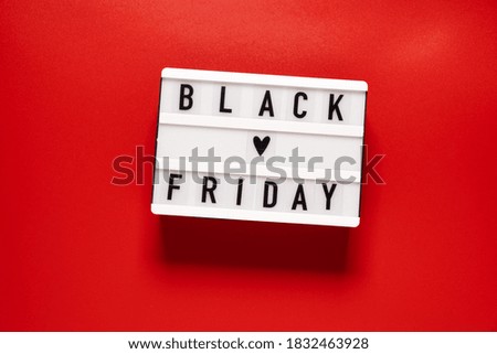 Black friday sale word on lightbox on red background