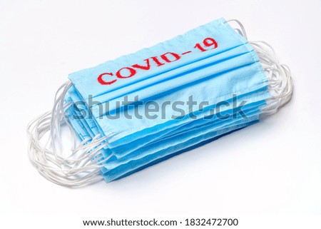 coronavirus COVID-19 pandemic concept - stack of antiviral surgical protective medical mask for protection against corona virus
