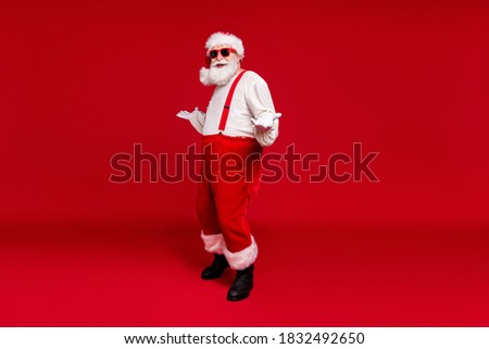 Full length body size view of his he handsome cheerful cheery glad bearded Santa hipster dancing having fun rest chill out December isolated bright vivid shine vibrant red color background