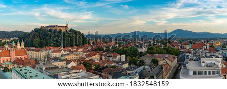 A panorama picture of Ljubljana overlooked by the Ljubljana Castle at sunset.
