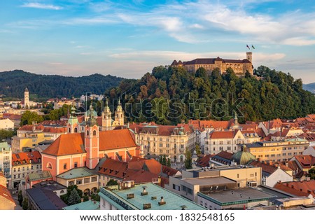 A picture of Ljubljana overlooked by the Ljubljana Castle at sunset.