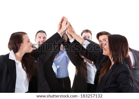 Businesspeople making high five gesture over white background