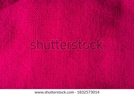 Red woolen texture, bay be used as background. Red fabric texture.