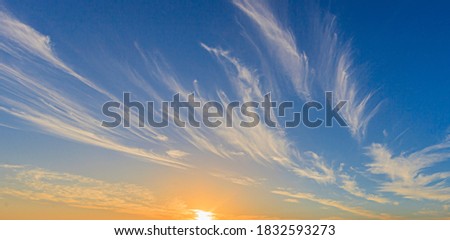 Picture of dramatic and colorful sky with sun during sunset