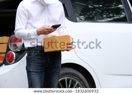 Delivery man sending cardboard box and free delivery transport. online shopping and express delivery