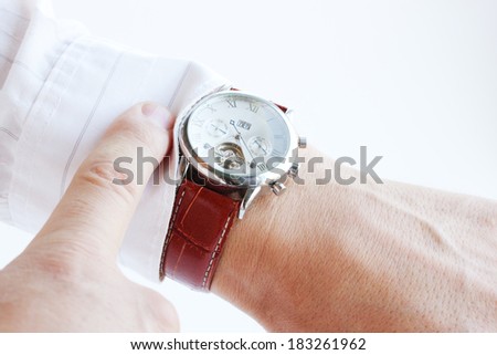 Men's hands, pointing the finger at the clock Royalty-Free Stock Photo #183261962