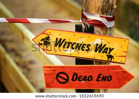 Halloween decoration. signs pointing in spooky directions outside
