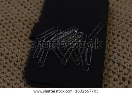 paper clips on a multicolored background