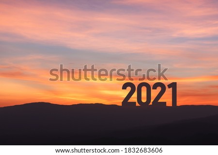New year 2021 concept with sunset sky and mountain background, Silhouette style Royalty-Free Stock Photo #1832683606