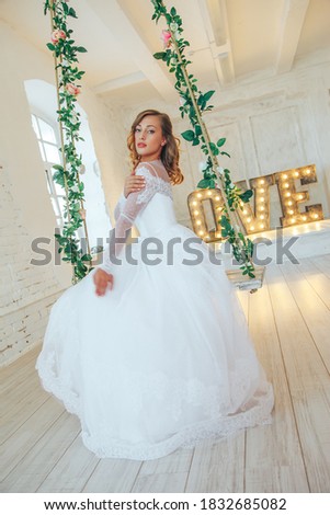 Wedding day and beautiful bride in studio. Beautiful young bride with wedding makeup and hairstyle. Portrait of young gorgeous bride. Wedding. Royalty-Free Stock Photo #1832685082