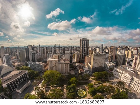 Aerial wide-angle landscape view of urbanized center with colorful skyscrapers in the morning - Santos Andrade Square - Curitiba, capital of Paraná State, Brazil Royalty-Free Stock Photo #1832689897
