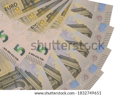 5 euro bills lies isolated on white background with copy space stacked in fan shape close up