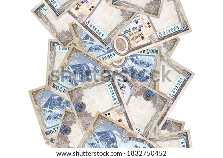 500 Nepalese rupees bills flying down isolated on white. Many banknotes falling with white copyspace on left and right side