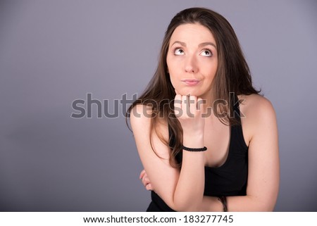 girl in a black shirt on a gray background