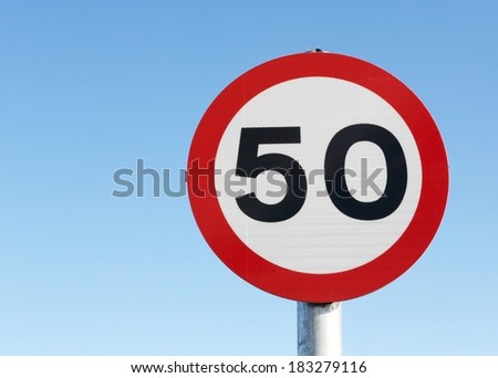 Fifty miles per hour speed limit sign against a clear blue sky. 