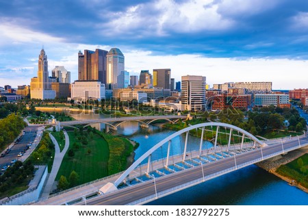 Aerial view of Downtown Columbus Ohio with Scioto river during sunset 
