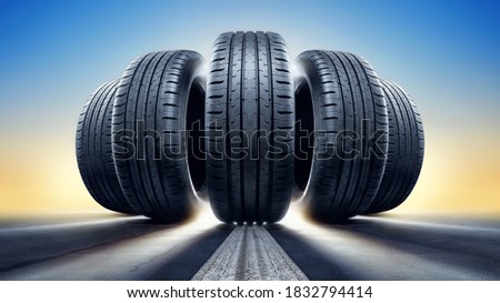 close up of five tires against a sunset Royalty-Free Stock Photo #1832794414